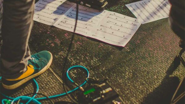 Musicians with gear and sheet music